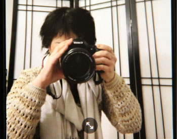 Raynette Yoshida with camera